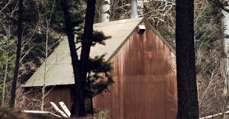 FILE - This April 6, 1996 file photo shows Ted Kaczynski's cabin in the woods of Lincoln, Mont. Twenty years after the arrest of Kaczynski, better known as the Unabomber, some Lincoln r