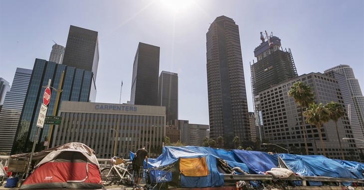 FILE - This Tuesday, Sept. 22, 2015 file photo shows tents used by the homeless lining a downtown Los Angeles street. On Tuesday, March 7, 2017, Los Angeles voters are picking a mayor a