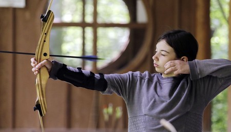 Why is Biden withholding funding for schools with archery and hunting programs?