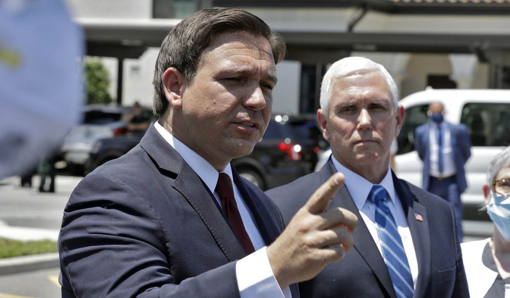 Mike Pence Accused of Playing From 'Shrug and Give up' Playbook in Backwards Disney Attack on Ron DeSantis