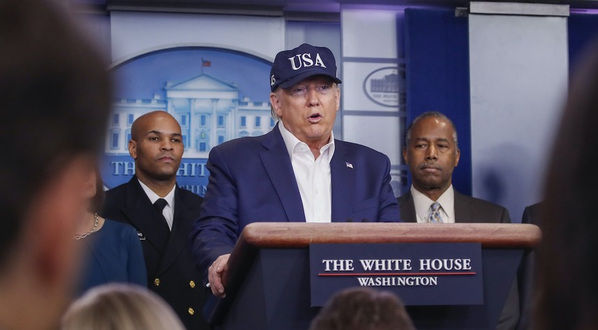 They've Got Him Now! Reporter Tweets Angst About Trump Wearing 'USA' Hat at Wuhan Virus Briefing