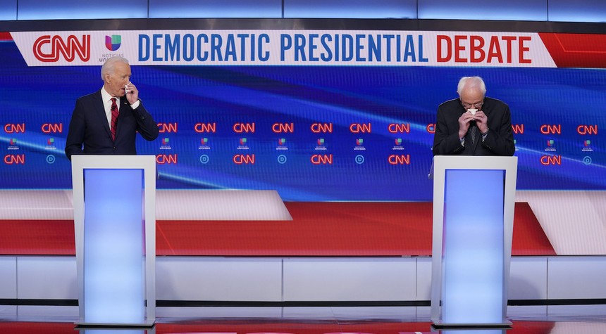 Watch: Biden Coughs In First Question of Debate, Says Doesn't Touch Face Just After He Touched His Face